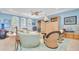 Relaxing living area featuring comfortable seating, nautical decor, and bright lighting at 860 Harbor Is, Clearwater Beach, FL 33767