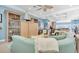 Bright and airy living room featuring a curved sofa, decor, and open layout at 860 Harbor Is, Clearwater Beach, FL 33767
