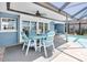 Outdoor patio with dining set featuring seating for four overlooking a pool and a spa at 860 Harbor Is, Clearwater Beach, FL 33767
