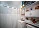 Functional bathroom features a shower, vanity, and built-in shelving for storage at 8742 Narcissus Ave, Seminole, FL 33777