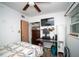 Bedroom with versatile layout, wood-look flooring, and ceiling fan at 8742 Narcissus Ave, Seminole, FL 33777