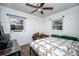 Bedroom with multiple windows, ceiling fan, and comfortable bed at 8742 Narcissus Ave, Seminole, FL 33777
