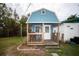 Shed featuring a porch and front door at 8742 Narcissus Ave, Seminole, FL 33777