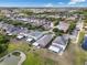 Aerial view of a residential neighborhood featuring ponds, well-maintained homes, and mature trees at 9031 Sienna Moss Ln, Riverview, FL 33578