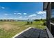 The property features a spacious backyard with views of the lake, as well as seating to enjoy the view at 9031 Sienna Moss Ln, Riverview, FL 33578