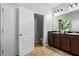 Bathroom showcasing a double sink vanity and adjacent water closet at 9031 Sienna Moss Ln, Riverview, FL 33578