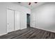 Bedroom featuring hard surface flooring and a closet with sliding doors at 9031 Sienna Moss Ln, Riverview, FL 33578