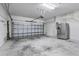 Attached garage with shelving and plenty of space for storage and parking at 9031 Sienna Moss Ln, Riverview, FL 33578
