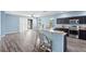 Bright kitchen featuring a breakfast bar, modern appliances, and open access to the living area at 9031 Sienna Moss Ln, Riverview, FL 33578