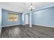 Bright and spacious living area with hardwood floors and a view of the front entrance at 9031 Sienna Moss Ln, Riverview, FL 33578