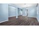 Open floor plan with hardwood floors, neutral paint, and an abundance of natural light at 9031 Sienna Moss Ln, Riverview, FL 33578