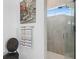 This bathroom features a glass shower door and tiled walls at 916 Seagrape Dr, Ruskin, FL 33570