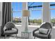 Bedroom seating area with river views and stylish decor at 916 Seagrape Dr, Ruskin, FL 33570
