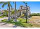 Inviting home boasts lush tropical landscaping and a well-manicured lawn, complemented by a stylish exterior at 916 Seagrape Dr, Ruskin, FL 33570