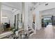 Bright foyer with staircase, view of dining area, and exterior scenery at 916 Seagrape Dr, Ruskin, FL 33570