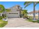 Attractive two-story home with a two-car garage and landscaped front yard at 916 Seagrape Dr, Ruskin, FL 33570