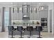 Contemporary kitchen featuring sleek cabinetry, a stylish island, and modern appliances at 916 Seagrape Dr, Ruskin, FL 33570