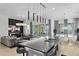The kitchen offers an open layout with a large center island, pendant lighting, and views of the living and dining areas at 916 Seagrape Dr, Ruskin, FL 33570