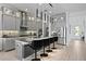 Modern kitchen with stainless steel appliances, pendant lighting, and a spacious island at 916 Seagrape Dr, Ruskin, FL 33570