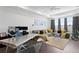 Bright living room features modern furniture, cool light fixtures, and large windows at 916 Seagrape Dr, Ruskin, FL 33570