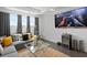 Comfortable living room with large windows and decor with greys, blacks, and yellows at 916 Seagrape Dr, Ruskin, FL 33570