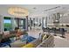 Spacious living area with modern lighting, an open floor plan, and views of the pool at 916 Seagrape Dr, Ruskin, FL 33570
