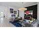 Elegant living room with contemporary furnishings, a fireplace, and colorful artwork at 916 Seagrape Dr, Ruskin, FL 33570