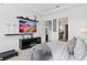 Bright and elegant main bedroom has television, seating and private entrance to ensuite bath at 916 Seagrape Dr, Ruskin, FL 33570