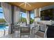 Outdoor kitchen with grill, bar, and waterfront views, perfect for outdoor entertaining at 916 Seagrape Dr, Ruskin, FL 33570