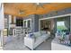 Entertainer's dream patio with outdoor kitchen, bar seating, and upscale finishes at 916 Seagrape Dr, Ruskin, FL 33570