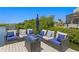Outdoor patio featuring comfortable seating around a fire pit, ideal for relaxing and entertaining with waterfront views at 916 Seagrape Dr, Ruskin, FL 33570
