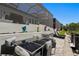 Outdoor patio features an elegant dining area and lounge seating with colorful statue art for stylish entertaining at 916 Seagrape Dr, Ruskin, FL 33570