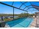 Stunning pool with water views, lush landscaping, and a relaxing atmosphere at 916 Seagrape Dr, Ruskin, FL 33570
