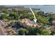 Aerial view of the condo featuring its location with water views and a swimming pool at 950 Broadway # 103, Dunedin, FL 34698