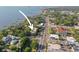 A captivating aerial view showcases the property's prime location near the waterfront at 950 Broadway # 103, Dunedin, FL 34698