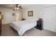 Bedroom with ceiling fan, double closets and ensuite access at 950 Broadway # 103, Dunedin, FL 34698