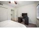 Bright bedroom with ceiling fan and desk area for convenient work space at 950 Broadway # 103, Dunedin, FL 34698
