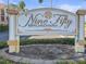 Elegant community sign with detailed lettering welcomes residents and guests to Nine Fifty Broadway at 950 Broadway # 103, Dunedin, FL 34698