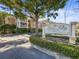 Elegant community sign welcomes residents and guests to Nine Fifty Broadway in front of the building at 950 Broadway # 103, Dunedin, FL 34698