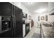 Well-equipped kitchen featuring granite countertops, modern appliances, and ample storage at 950 Broadway # 103, Dunedin, FL 34698