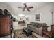 Open concept living room and dining area with tile floor and neutral color palette at 950 Broadway # 103, Dunedin, FL 34698