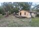 Exterior view showcasing a house with a wooden deck with great backyard space at 9810 Parsons St, Tampa, FL 33615