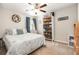 Cozy bedroom with coastal decor, a ceiling fan, and a sunny window at 10036 Crested Fringe Dr, Riverview, FL 33578