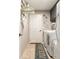 Convenient laundry room equipped with a washer, dryer, and storage shelves at 10036 Crested Fringe Dr, Riverview, FL 33578