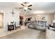 Bright and spacious living room featuring plush seating, modern décor, and an open layout to the kitchen at 10036 Crested Fringe Dr, Riverview, FL 33578