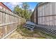 Backyard view showing the steps leading to the lattice-skirted screened-in pool and deck at 1017 Hamilton Ave, Tarpon Springs, FL 34689