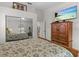 Comfortable bedroom featuring a mirrored closet and a television on a dresser at 1017 Hamilton Ave, Tarpon Springs, FL 34689