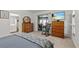 Bright bedroom featuring a rocking chair, television, and sliding door access to the lanai at 1017 Hamilton Ave, Tarpon Springs, FL 34689