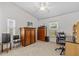 Bright bedroom with vaulted ceiling, multiple windows, and a dedicated workspace at 1017 Hamilton Ave, Tarpon Springs, FL 34689