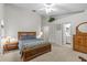 Serene bedroom with a large window, ample closet space, and a connected bathroom at 1017 Hamilton Ave, Tarpon Springs, FL 34689
